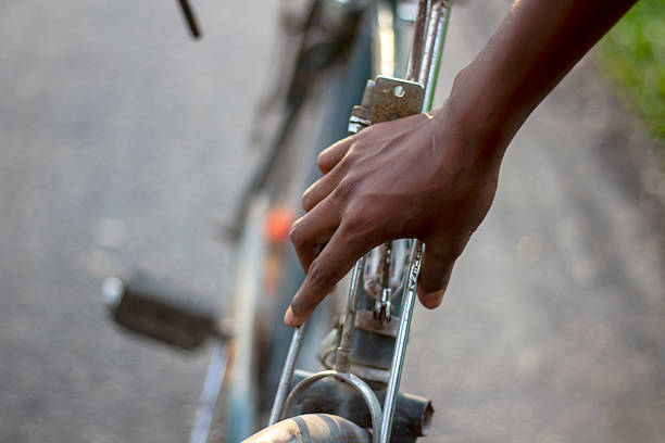 istock A hand grips the handlebars of a bicycle, ready for a ride on a sunny day 2231132616