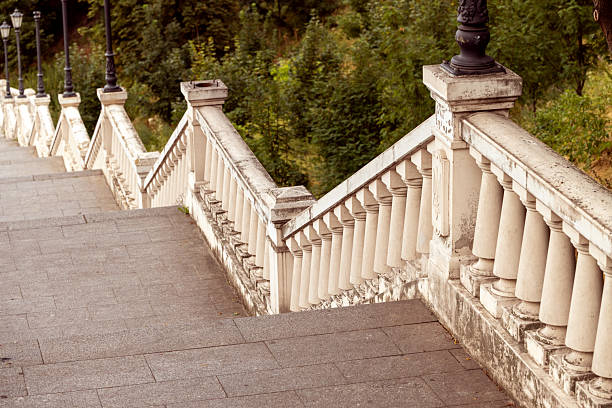 an old staircase with beautiful concrete handrails