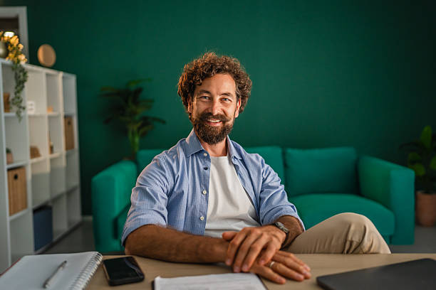 istock Portrait of smiling freelancer working from home office 2231135617