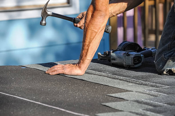 istock close up on worker using hammer repairing roof 2231139770