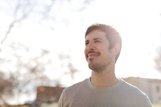 istock Serene man looking ahead in sunlight outdoors 2231140946