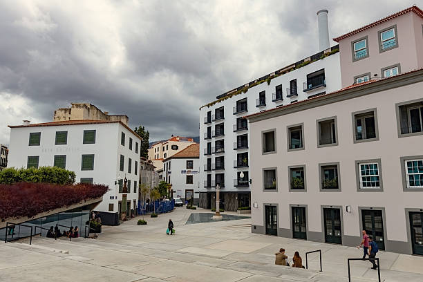 Modern square with Casa do Passo building and contemporary architecture under cloudy sky in Funchal, Madeira, Portugal