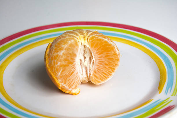 Tangerines group of citrus fruits closeup with leaves isolated on white background