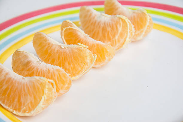 Fresh orange tangerines on the white background. Christmas atmosphere fruits.