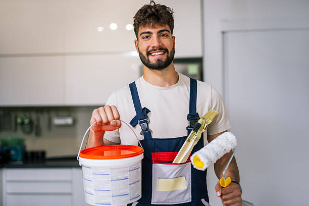 Painter Preparing to Paint Apartment Walls stock photo