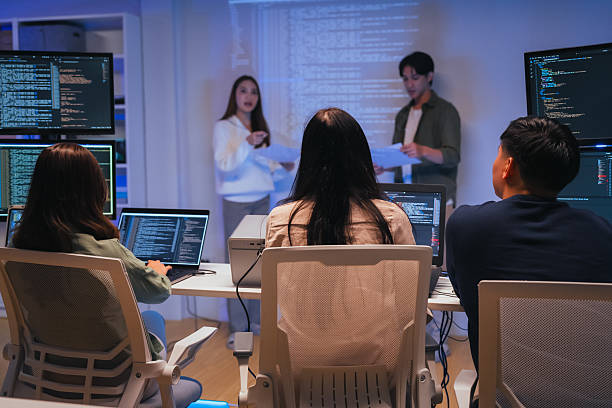 istock Our vibrant programmer team brainstorm discuss at night to discuss project goals and various strategic innovations. We actively reviewed code, focusing on the development of vital systems vision 2231144114