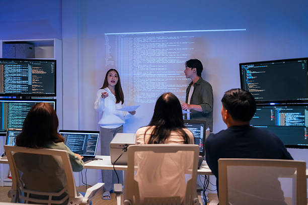 istock Our vibrant programmer team brainstorm discuss at night to discuss project goals and various strategic innovations. We actively reviewed code, focusing on the development of vital systems vision 2231144134