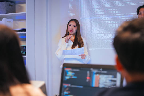 istock Our vibrant programmer team brainstorm discuss at night to discuss project goals and various strategic innovations. We actively reviewed code, focusing on the development of vital systems vision 2231144137