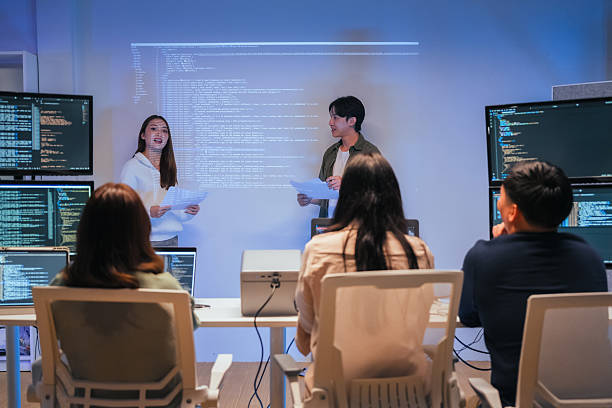 istock Our vibrant programmer team brainstorm discuss at night to discuss project goals and various strategic innovations. We actively reviewed code, focusing on the development of vital systems vision 2231144143