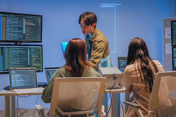 istock Young Asian man software developers mentor leader manager Verification and validation in software testing ensure developers drive the development of engineering technologies Programmer development 2231144619