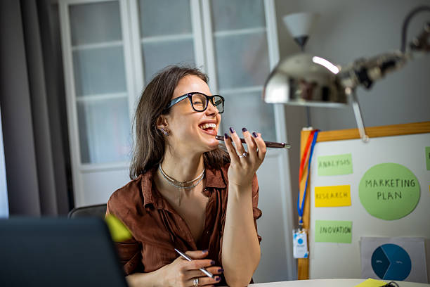 istock Young Woman Working from Home Sending Voice Messages 2231145167