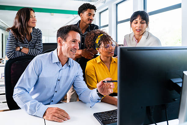 istock Business people collaborating on computer in modern office 2231145288