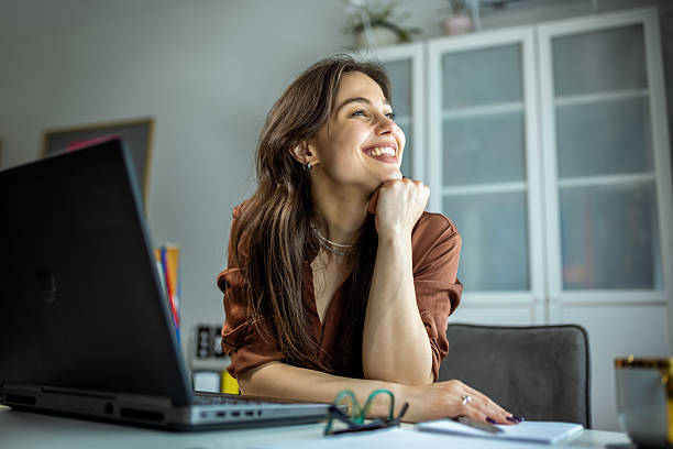 istock Young Woman Working from Home on Laptop 2231145400
