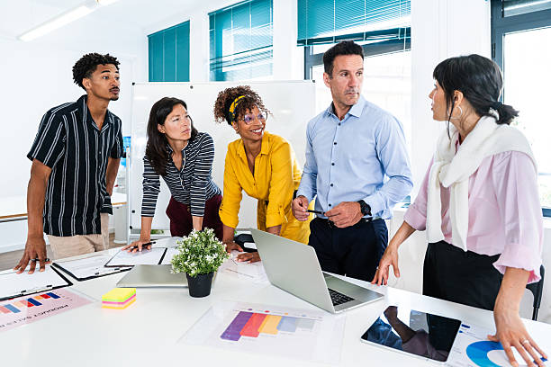 istock Business people collaborating on project in startup office meeting 2231145931