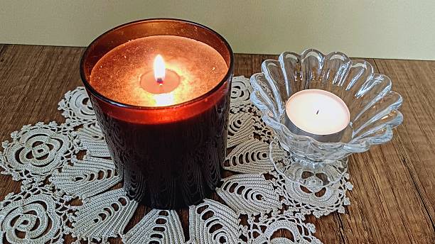 istock Decorative candle in brown glass. Candlelight 2231146790