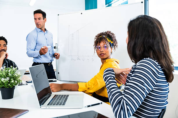 istock Business team analyzing data and discussing strategies in office meeting 2231148034