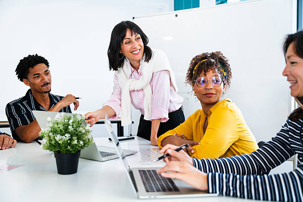 istock Business people collaborating during meeting in modern office 2231148320
