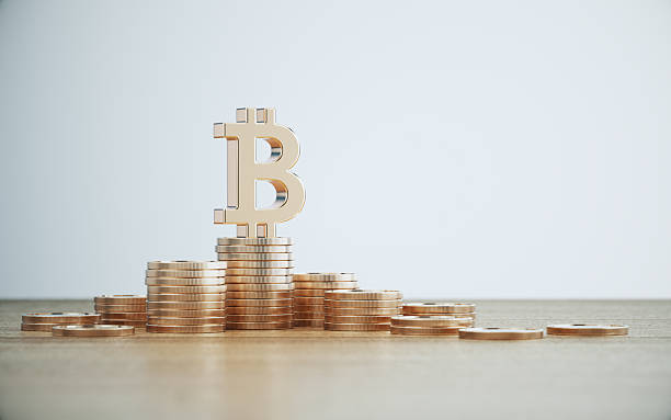 istock Bitcoin Symbol Sitting on Coin Stack Over Defocused Wood Background 2231148327