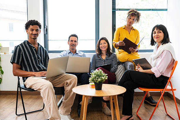 istock Business people working together in modern office using digital devices 2231151558