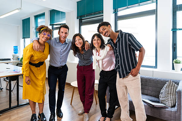 istock Startup business team smiling and embracing in modern office 2231151879
