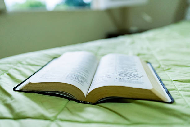 istock Bible on the bed 2231153235
