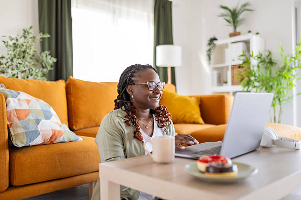 istock Happy young woman is working from home 2231154081