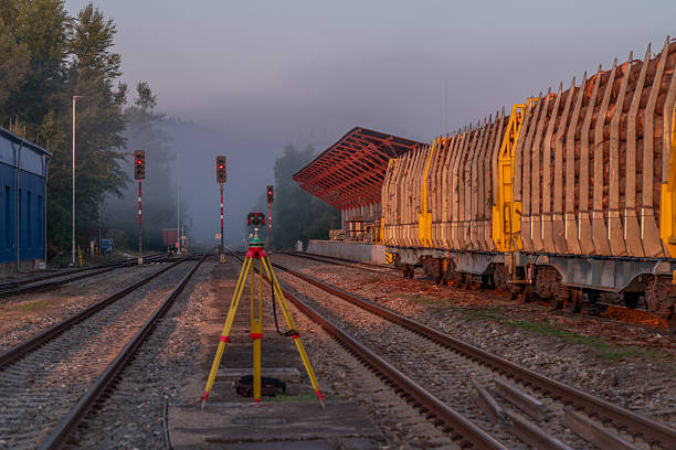 Surveyor with hard orange tripod and mirrors in station Volary CZ 08 15 2025
