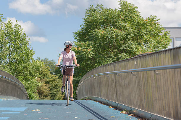 istock Cyclist enjoying a sunny day on a bridge 2231158447
