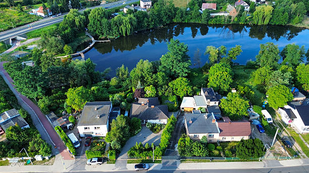 istock Houses by Lake with Trees 2231161103