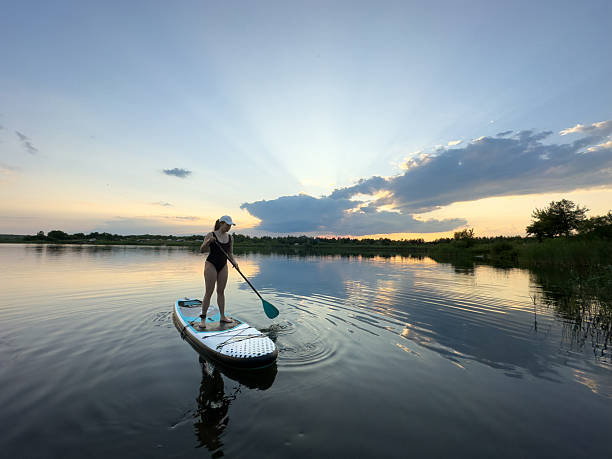 istock Paddleboarding at Sunset on a Tranquil Lake 2231161807