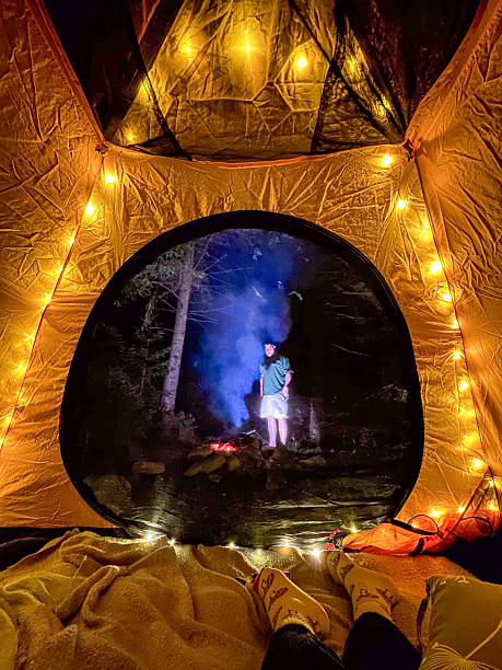 istock Cozy Tent View with Campfire in Forest 2231161811