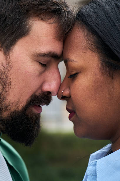 istock Interracial couple sharing intimate moment with foreheads touching 2231162345