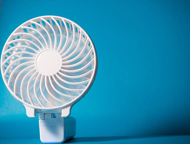 istock Desk fan on cool blue background 2231163587
