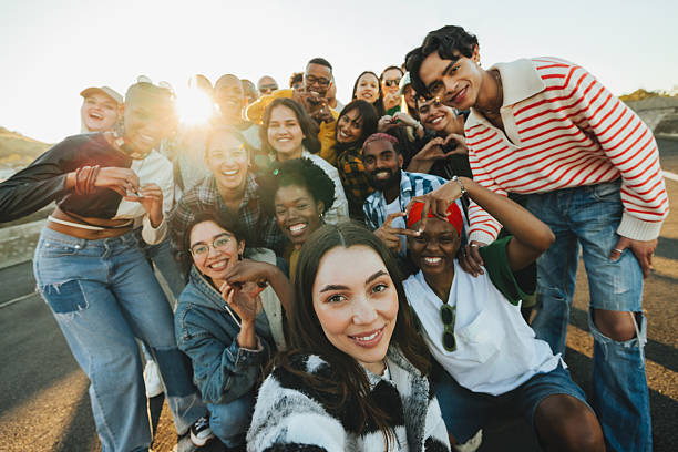 istock Group of young adults standing outdoors expressing unity and positivity 2231164629