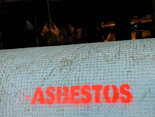 asbestos inscription on pipe texture. harmful materials