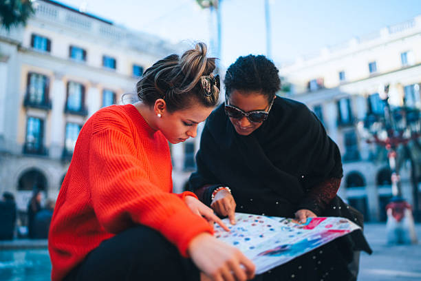 istock Tourists navigating with a map at Placa Reial, Barcelona 2231178325