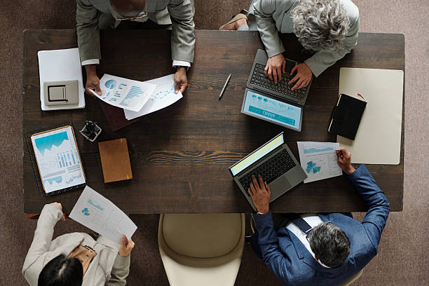 istock Diverse Group of Middle Aged Professionals Analyzing Financial Reports 2231181742