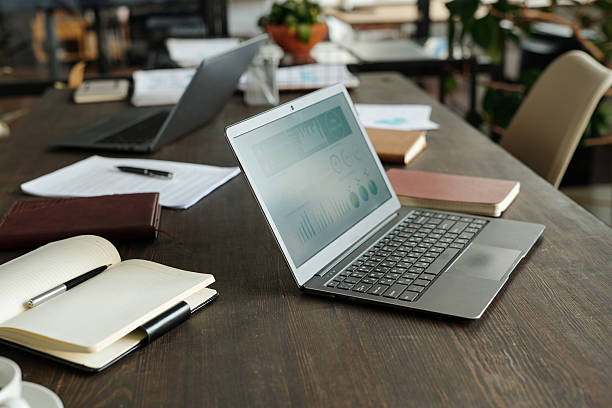 istock Laptop Displaying Business Analytics on Table during Office Meeting 2231181775