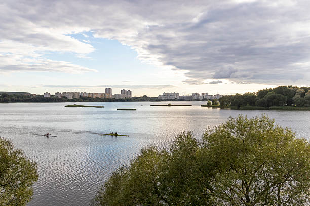 istock People practicing rowing on the lake. Sports 2231181948