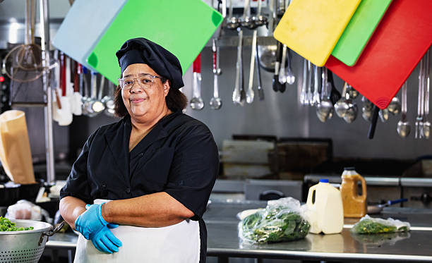 istock Senior black woman working as cook in restaurant kitchen 2231182252