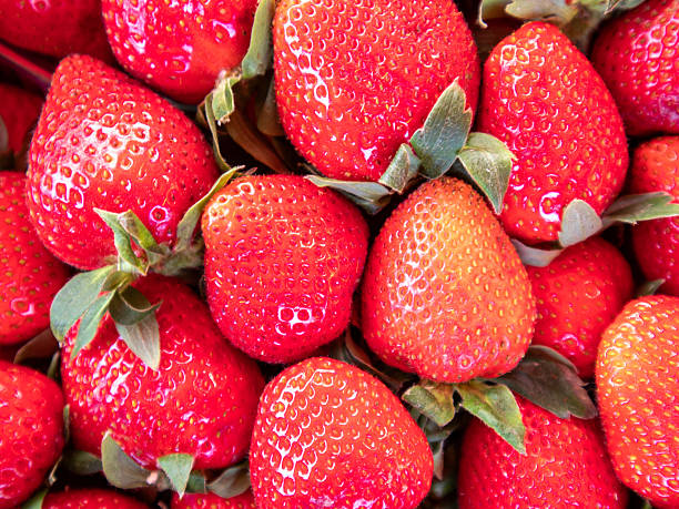 Fresh Red Strawberries Piled Together at a Local Market