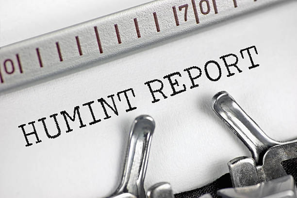 istock Human intelligence (acronym HUMINT) report text macro closeup, typewriter typed interpersonally gathered intel data analysis reporting document concept crucial information collection and decision making metaphor large detailed horizontal retro studio shot 2231182644