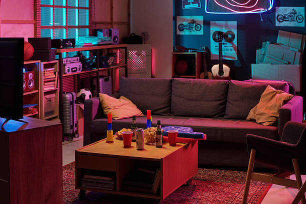 istock Modern Living Room Interior Featuring Couch and Table with Snacks and Drinks 2231183031