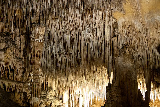 istock Majestic stalactites and stalagmites: stunning natural cave formation with dramatic lighting 2231185310