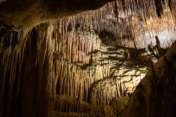 istock Majestic stalactites and stalagmites illuminate a mysterious limestone cave interior 2231185356
