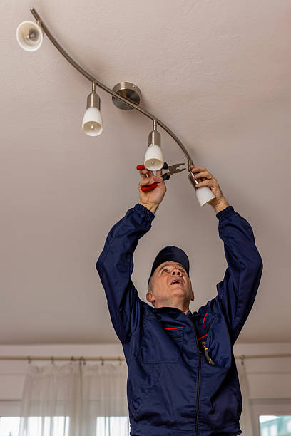 istock An electrician installing led light bulbs at home for power saving. 2231186627