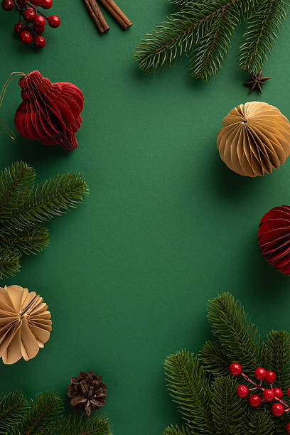 istock Holiday vertical decorations featuring paper ornaments, red berries, and evergreen branches create a festive atmosphere 2231193388