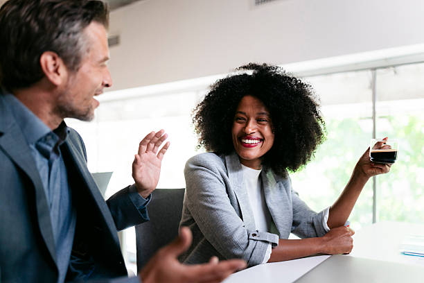 istock Business people having a conversation during a coffee break 2231193758