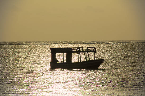 Fishing boat panoramic horizon view during golden hour, Indian ocean, Kenya