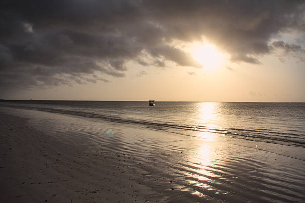 Sunrise over the Indian ocean on cloudy warm sky, Diani beach, Kenya